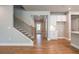 Staircase with black metal railing and hardwood floors at 7640 Homer Dr, Cumming, GA 30028