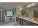Elegant bathroom with double vanity, soaking tub, and walk-in shower at 1721 Cobblefield Cir, Dacula, GA 30019