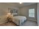 Cozy bedroom with neutral decor and a window with blinds at 1721 Cobblefield Cir, Dacula, GA 30019