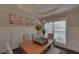 Charming dining room with a chandelier and wainscoting at 1721 Cobblefield Cir, Dacula, GA 30019