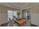 Bright dining room with hardwood floors and access to the home office at 1721 Cobblefield Cir, Dacula, GA 30019