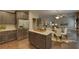Open concept kitchen with island and stainless steel appliances at 1721 Cobblefield Cir, Dacula, GA 30019