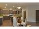 Modern kitchen with dark cabinets, stainless steel appliances, and breakfast nook at 1721 Cobblefield Cir, Dacula, GA 30019