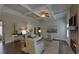 Open living room with a fireplace and coffered ceiling at 1721 Cobblefield Cir, Dacula, GA 30019