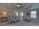 Spacious main bedroom with tray ceiling and ample natural light at 1721 Cobblefield Cir, Dacula, GA 30019