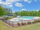 Inviting community pool with a mushroom water feature and surrounding landscaping at 1721 Cobblefield Cir, Dacula, GA 30019