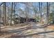 Ranch home with a long driveway, surrounded by trees at 3455 Broxton Mill Way, Snellville, GA 30039