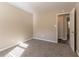 Spacious, carpeted bedroom with neutral colored walls at 633 Larchmont Nw Cir, Atlanta, GA 30318