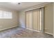 Spacious bedroom with sliding glass doors, neutral walls, and plush carpeting at 633 Larchmont Nw Cir, Atlanta, GA 30318