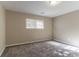 Sunlit bedroom with carpeting and neutral walls at 633 Larchmont Nw Cir, Atlanta, GA 30318
