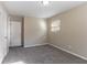 Cozy bedroom with neutral walls, carpeting, and natural light at 633 Larchmont Nw Cir, Atlanta, GA 30318