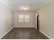 Dining room with neutral walls, wood-look flooring, and a window at 633 Larchmont Nw Cir, Atlanta, GA 30318
