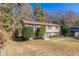 Charming two-story home nestled among trees with a welcoming front yard at 633 Larchmont Nw Cir, Atlanta, GA 30318