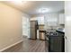 Updated kitchen with white cabinets, stainless steel appliances, and granite countertops at 633 Larchmont Nw Cir, Atlanta, GA 30318