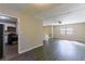 Living room with wood-look floors and open to the kitchen at 633 Larchmont Nw Cir, Atlanta, GA 30318