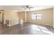 Spacious living room with dark wood-look flooring and abundant natural light at 633 Larchmont Nw Cir, Atlanta, GA 30318
