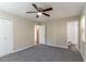 Large main bedroom with ensuite bathroom, ceiling fan, and carpeted floors at 633 Larchmont Nw Cir, Atlanta, GA 30318