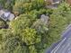 Aerial view of house nestled in a wooded lot, near a highway at 1900 Harper Nw Rd, Atlanta, GA 30318
