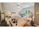 Cozy bedroom with a comfy bed, a seating area and plenty of natural light at 1900 Harper Nw Rd, Atlanta, GA 30318