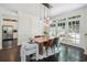 Bright dining room with hardwood floors, modern light fixture, and access to backyard at 1900 Harper Nw Rd, Atlanta, GA 30318