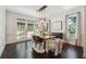 Elegant dining room with hardwood floors, french doors, and a wood dining table at 1900 Harper Nw Rd, Atlanta, GA 30318