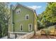 Attractive green house with a two-car garage at 1900 Harper Nw Rd, Atlanta, GA 30318