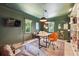 Home office with green walls, built-in shelving, and a stylish desk setup at 1900 Harper Nw Rd, Atlanta, GA 30318