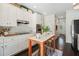 Galley kitchen with white cabinets, marble countertops and a kitchen island at 1900 Harper Nw Rd, Atlanta, GA 30318