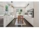 Modern kitchen with white cabinets, quartz countertops, and stainless steel appliances at 1900 Harper Nw Rd, Atlanta, GA 30318