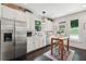 Modern kitchen with white cabinets, stainless steel appliances, and kitchen island at 1900 Harper Nw Rd, Atlanta, GA 30318