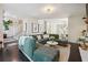 Open living room featuring a large sectional sofa and a view into the dining area at 1900 Harper Nw Rd, Atlanta, GA 30318