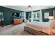 Spacious main bedroom with teal walls, hardwood floors, and large windows at 1900 Harper Nw Rd, Atlanta, GA 30318