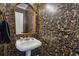Charming powder room with unique wallpaper and a pedestal sink at 1900 Harper Nw Rd, Atlanta, GA 30318