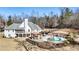 Aerial view of the backyard showcasing a pool, gazebo, and surrounding landscape at 265 Crooked Creek Trl, Canton, GA 30115