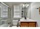 Clean bathroom with shower/tub combo and modern fixtures at 635 Earlham Dr, Suwanee, GA 30024