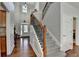 Welcoming foyer with hardwood floors and a grand staircase at 635 Earlham Dr, Suwanee, GA 30024