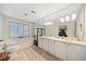 Elegant bathroom with double vanity, soaking tub, and large mirror at 1532 Oak Grove Rd, Decatur, GA 30033