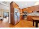 Bright kitchen with stainless steel appliances and wood cabinetry at 1532 Oak Grove Rd, Decatur, GA 30033