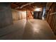 Unfinished basement with concrete flooring and exposed framing at 1378 Wesley Oaks Nw Ct, Atlanta, GA 30327