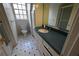 Bathroom featuring a dark countertop, toilet, and tiled floor at 1378 Wesley Oaks Nw Ct, Atlanta, GA 30327
