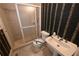 Bathroom with a shower, toilet, and sink at 1378 Wesley Oaks Nw Ct, Atlanta, GA 30327