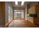 Breakfast nook with hardwood floors, large windows, and skylights at 1378 Wesley Oaks Nw Ct, Atlanta, GA 30327