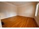 Dining room with hardwood floors, white wainscoting, and crown molding at 1378 Wesley Oaks Nw Ct, Atlanta, GA 30327