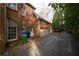 Three-car garage, driveway, and brick exterior of a house at 1378 Wesley Oaks Nw Ct, Atlanta, GA 30327