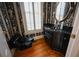 Powder room with decorative wallpaper, black vanity, and wood floors at 1378 Wesley Oaks Nw Ct, Atlanta, GA 30327