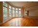 Spacious living room with hardwood floors and large windows offering ample natural light at 1378 Wesley Oaks Nw Ct, Atlanta, GA 30327