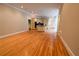 Spacious living room with hardwood floors and an open view to the kitchen at 1378 Wesley Oaks Nw Ct, Atlanta, GA 30327
