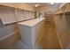 Large, empty walk-in closet with built-in shelving and drawers at 1378 Wesley Oaks Nw Ct, Atlanta, GA 30327