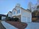 Two-story house with two-car garage and landscaping at 205 Walkers Ct, Villa Rica, GA 30180