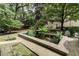 Charming courtyard with a central fountain and lush landscaping at 2222 Peachtree Nw Rd # C6, Atlanta, GA 30309